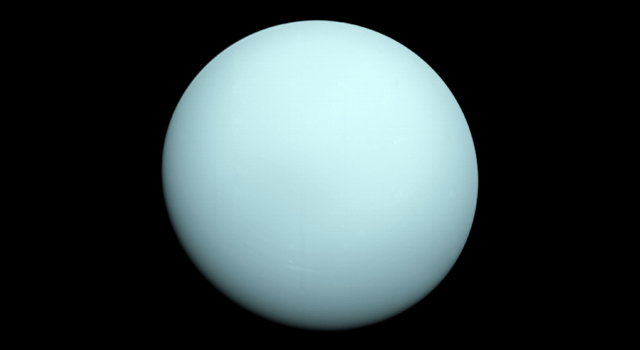 Arriving at Uranus in 1986, Voyager 2 observed a bluish orb with extremely subtle features. A haze layer hid most of the planet's cloud features from view. Credit: NASA/JPL-Caltech