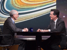 Against the backdrop of an image of Saturn's rings taken by NASA's Voyager mission, project scientist Ed Stone describes the 36-year journey of the two Voyager spacecraft. Stone was a guest on the Colbert Report on Dec. 3, 2013.