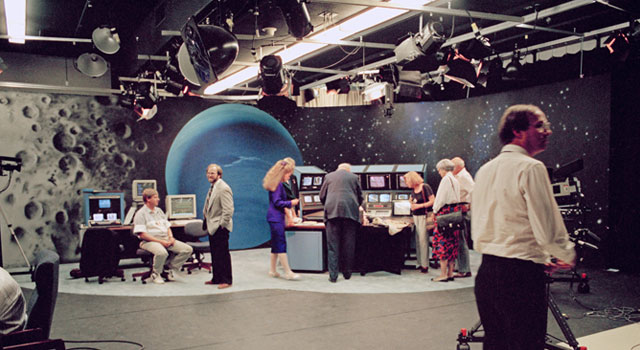 The television studio at NASA's Jet Propulsion Laboratory featured an atmospheric, painted backdrop and live video displays for sharing science data and spacecraft information with the media and public. Image credit: NASA/JPL-Caltech