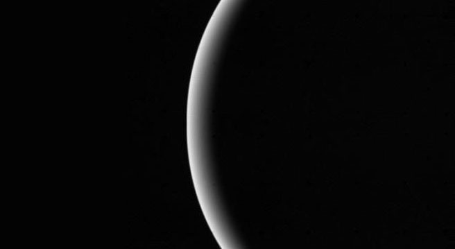 Voyager 2 shows crescent of Uranus