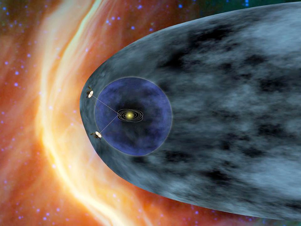 This artist’s concept shows NASA’s two Voyager spacecraft exploring a turbulent region of space known as the heliosheath, the outer shell of the bubble of charged particles around our sun.