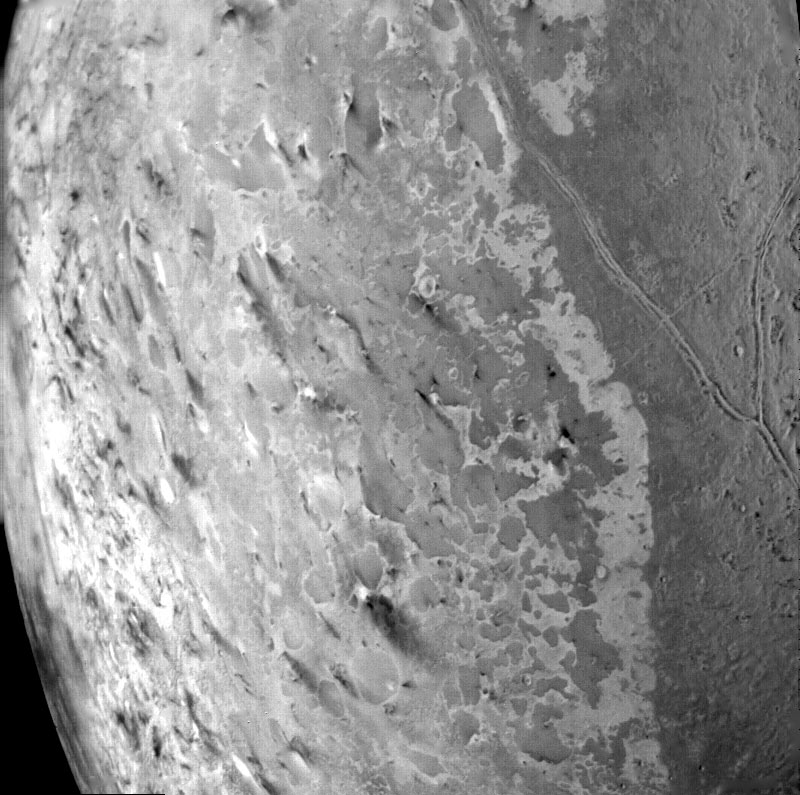 Triton’s south polar terrain. About 50 dark plumes mark what may be ice volcanoes.