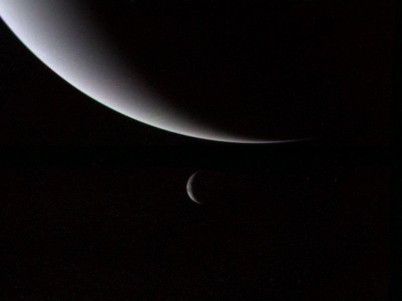 Neptune and Triton 3 days after flyby. Triton is smaller crescent and is closer to viewer.