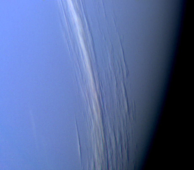 High-altitude cloud streaks in Neptune’s atmosphere.