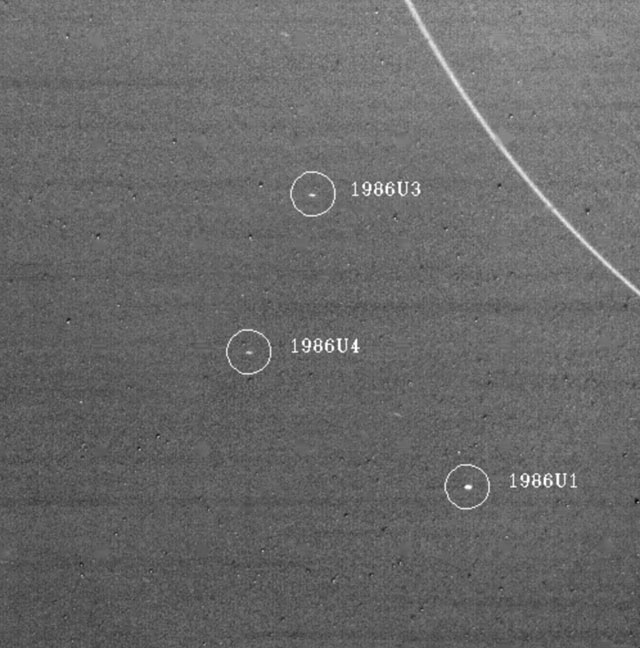 Three of the moons discovered by Voyager 2: 1986U1, 1986U3, and 1986U4. January 18, 1986. Range 4.8 million miles.