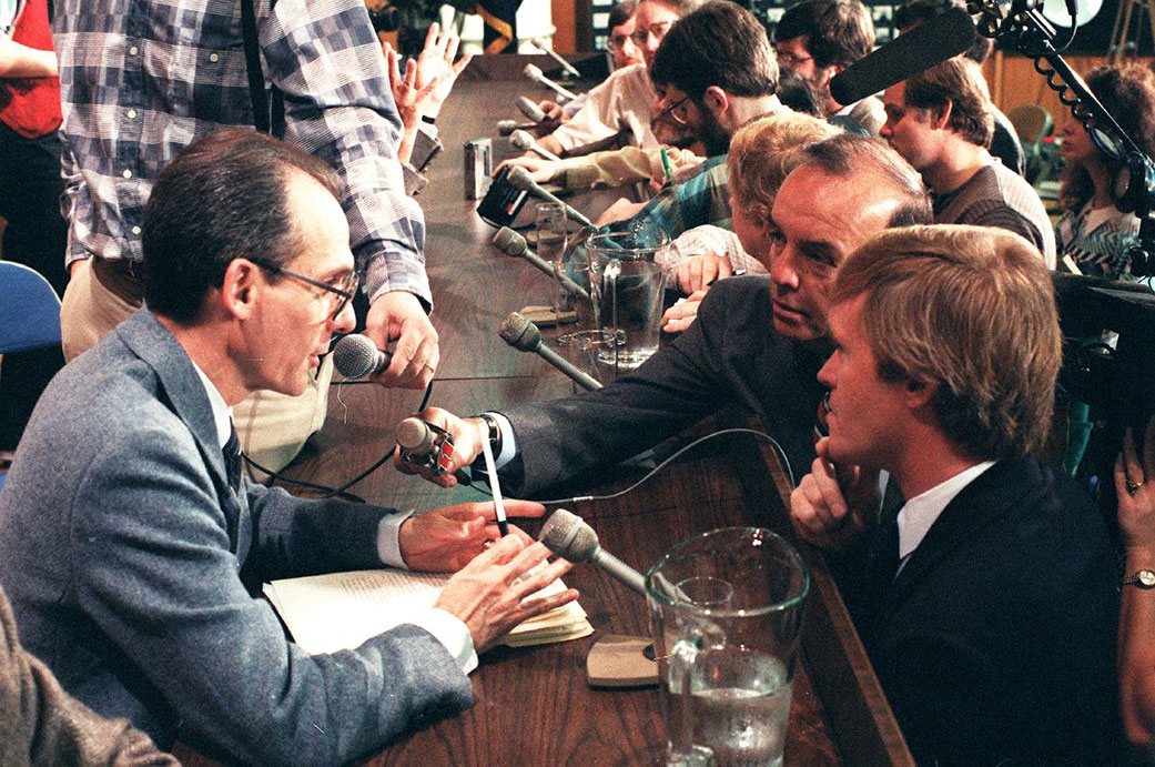 Ed Stone, left, talks to reporters at a news conference